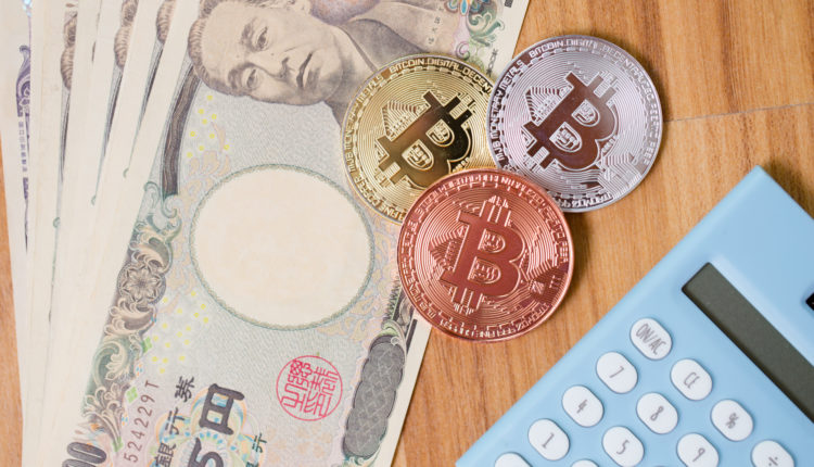 Bitcoin Cryptocurrency with Japan Yen money